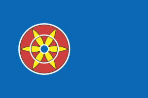 Mørkeblått flaggg med en solblomst med seks gule kronblader på en rød sirkel.